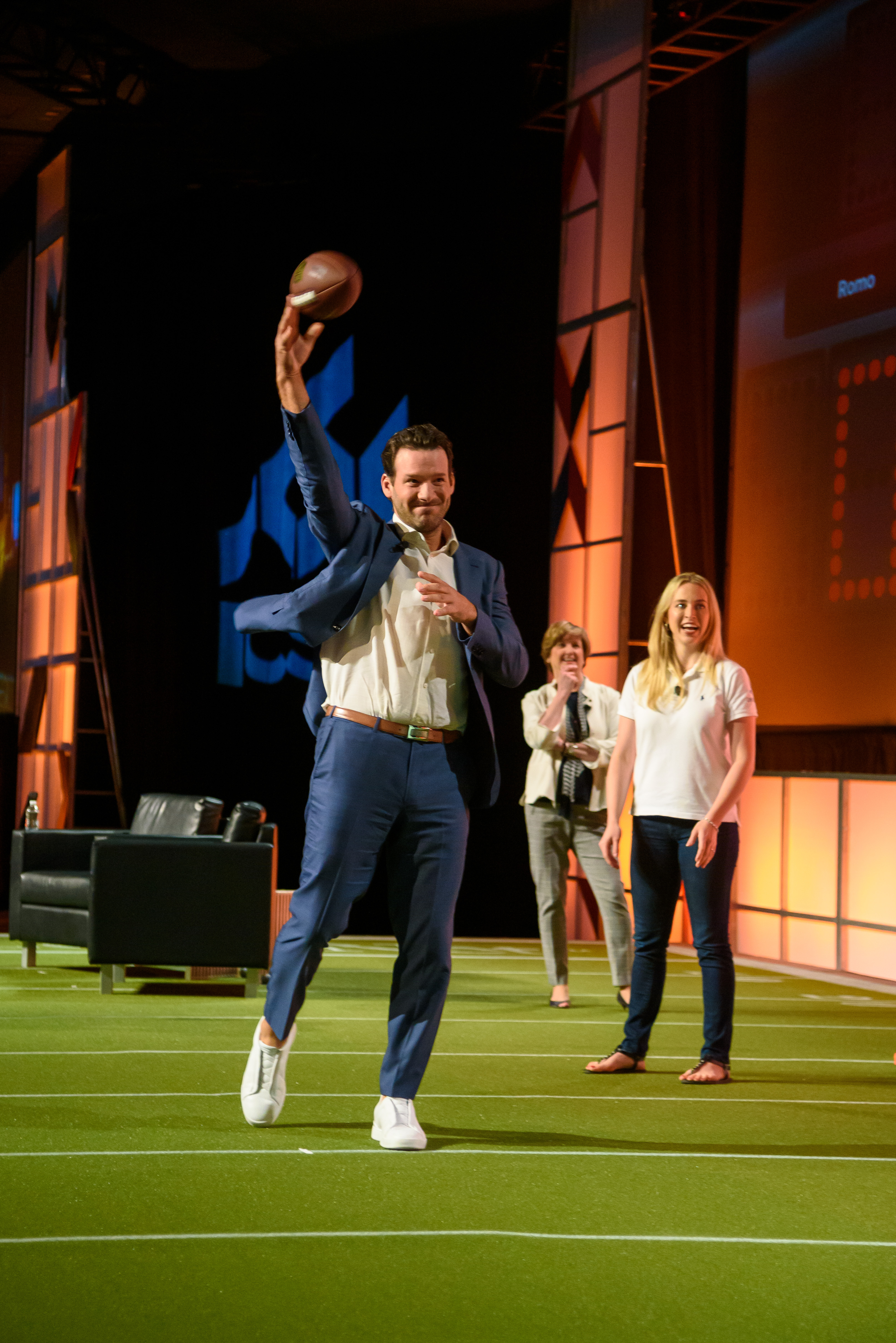 Tony Romo and Centennial Real Estate's Kristin Baisch compete for charity at RECon