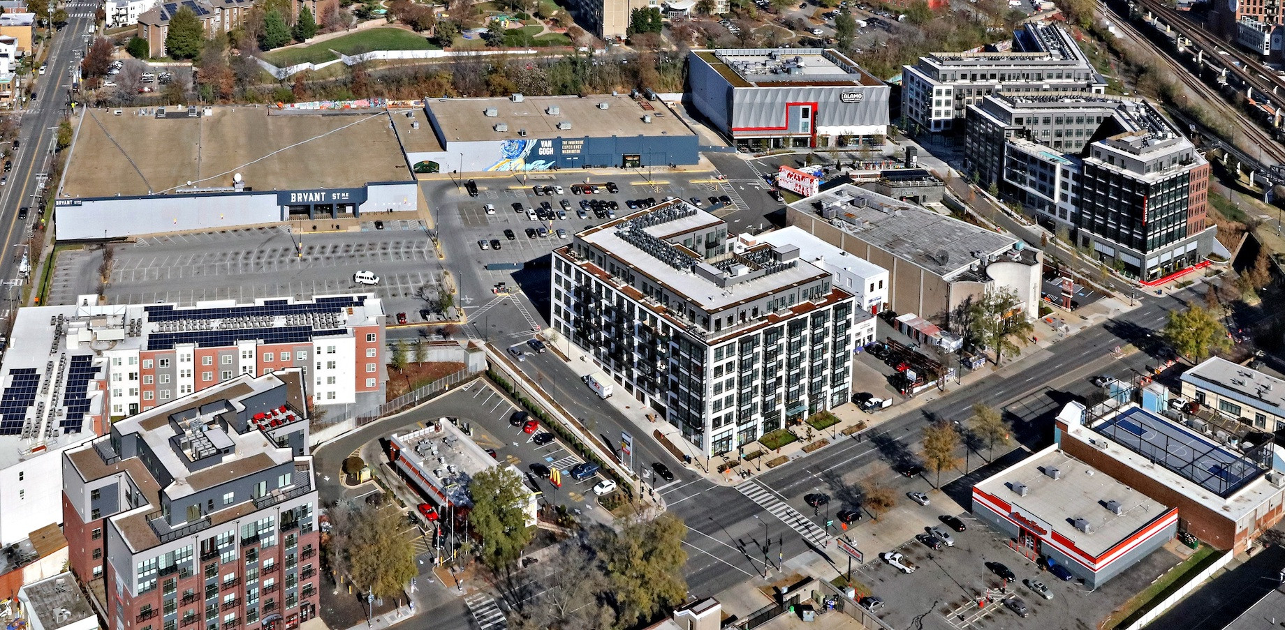 At the redeveloped Bryant St NE, an existing building on the left became a Kraken Kourts & Skates, and another in the mid
