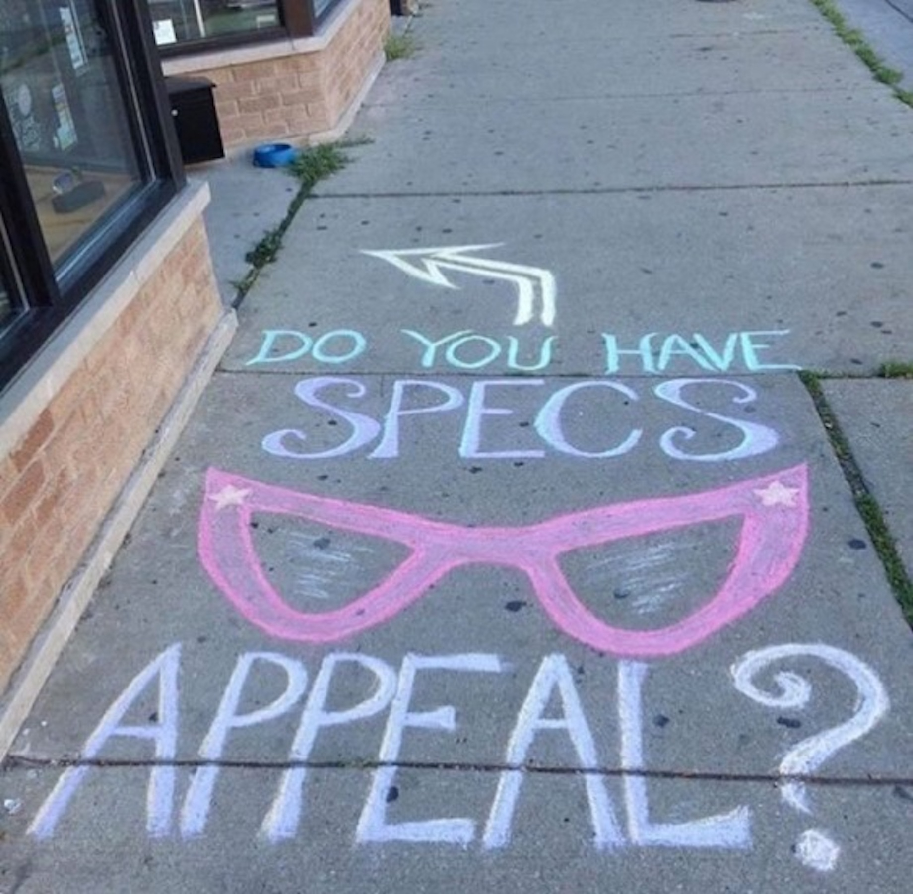 Sidewalk chalk takes advantage of unused space and is free and easier than adhesive floor signage.