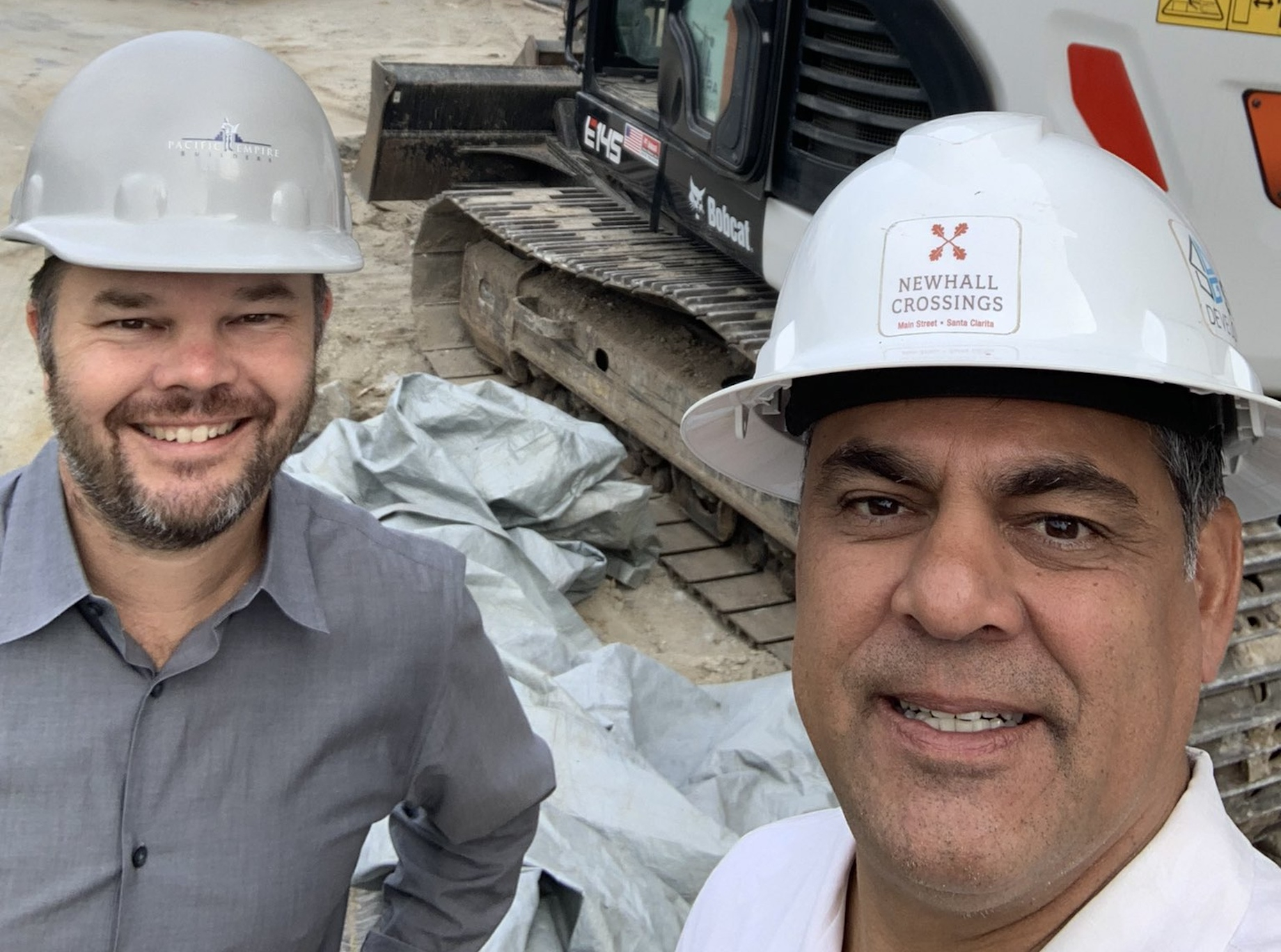 Kosmont Cos. president Ken Hira and Serrano Development Group principal Jason Tolleson in 2021 toured The Orchard, a resident