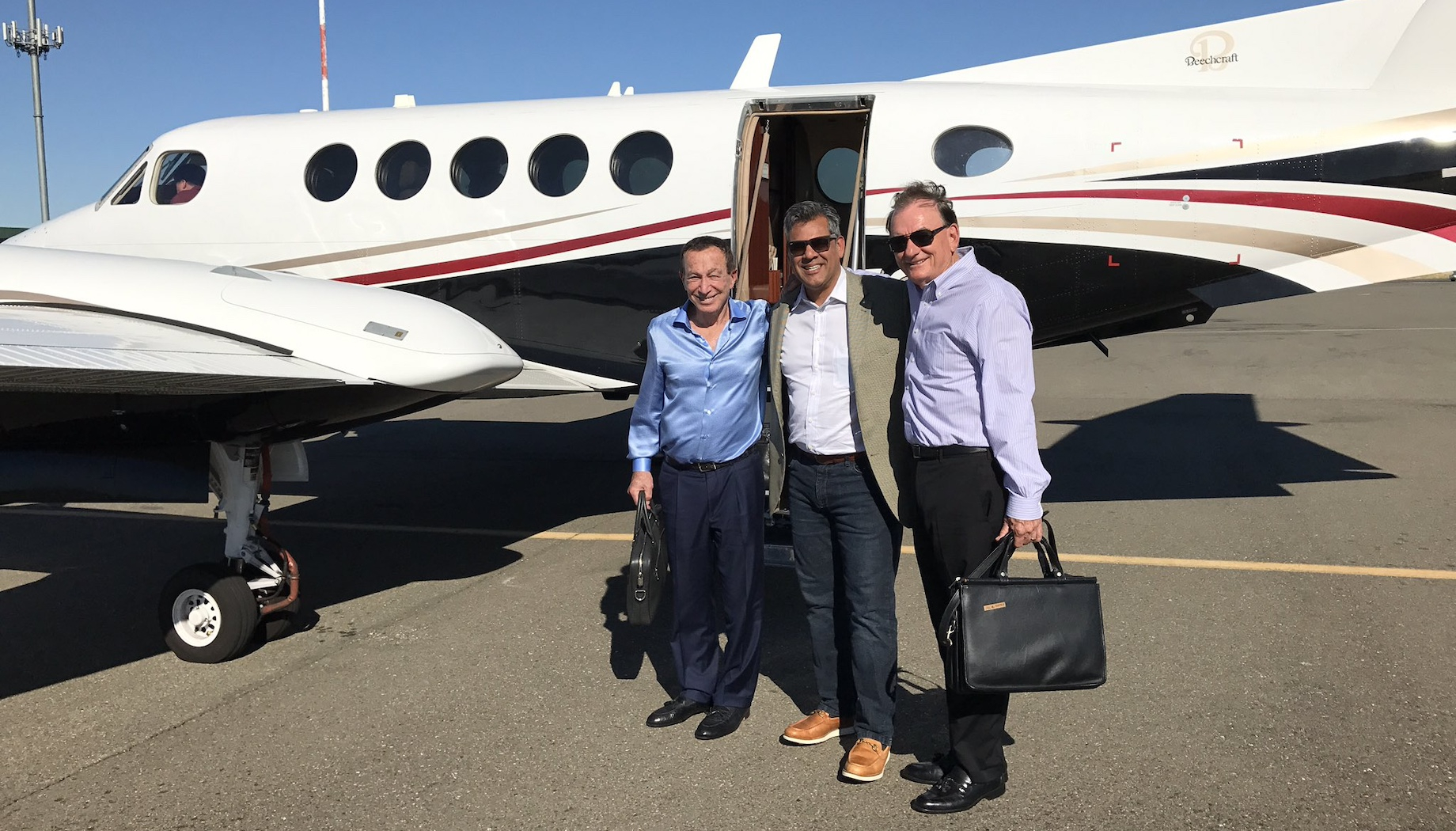 Kosmont Cos.’ president Ken Hira, center, with Lewis Group of Cos. president of California operations Richard Lewis on the le