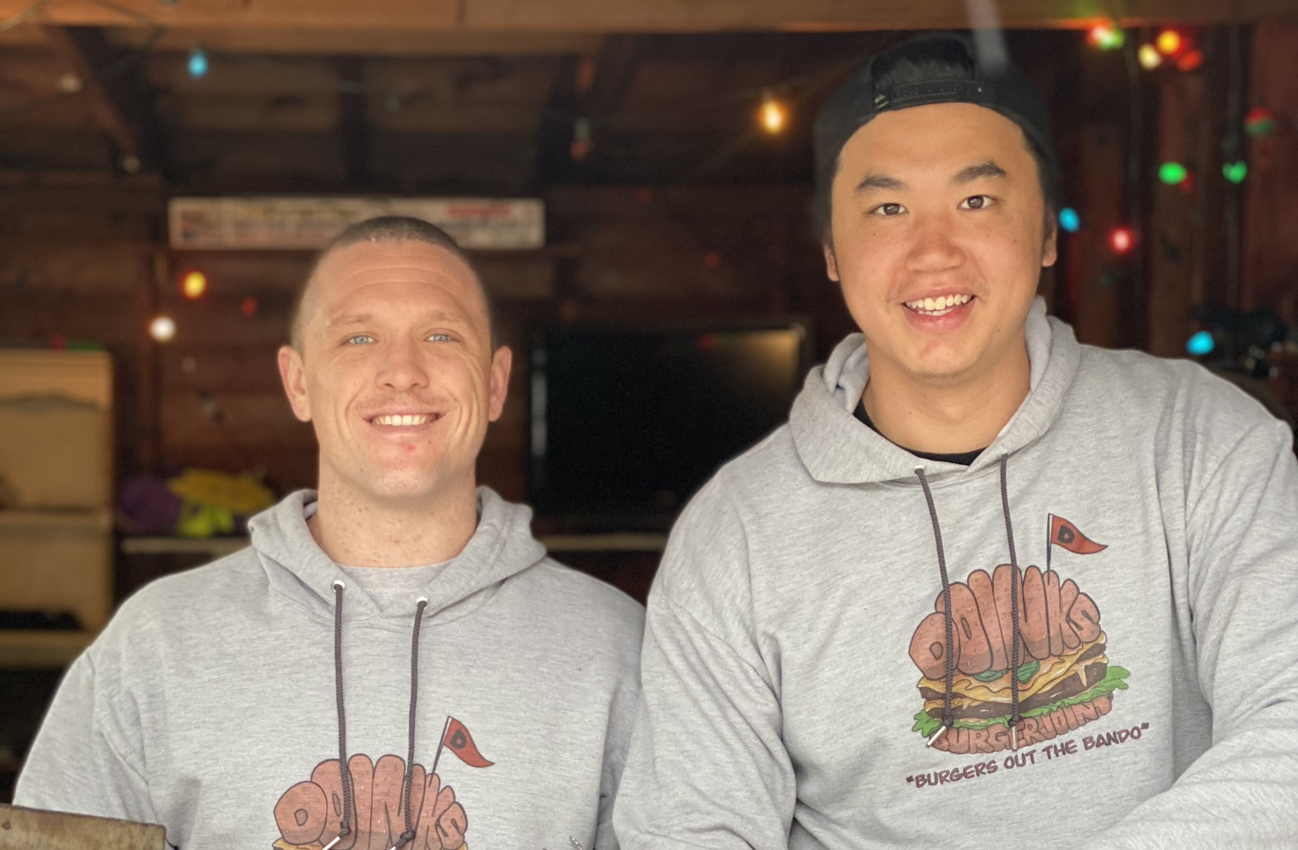 Doinks Burger Joint co-owners Peter Brown, at left, and Bonn Rassavong, at right, started selling burgers from Rassavong’s ho