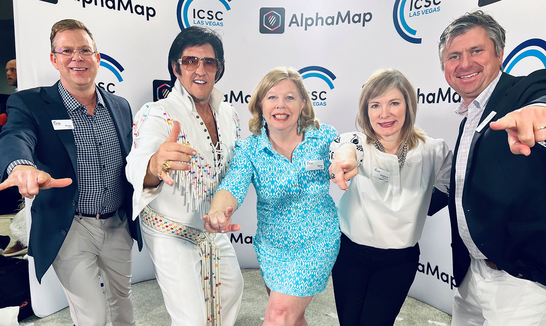 Betsy Laird, center, at ICSC LAS VEGAS in 2023 with colleagues Phillips Hinch, at far left, Stephanie Lockwood, second from r