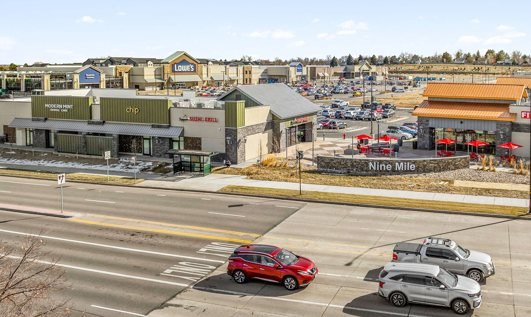 The mixed-use Nine Mile Corner center in Erie, Colorado, is anchored by Lowe’s Home Improvement and grocer King Sooper, the l
