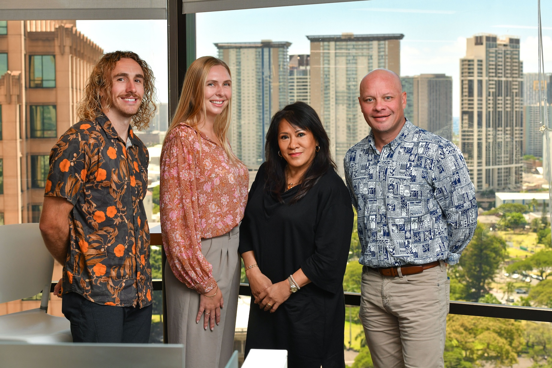 From left to right are CBRE sales support associate Connor Patterson, Graf, Preus and managing director for the Hawaii region
