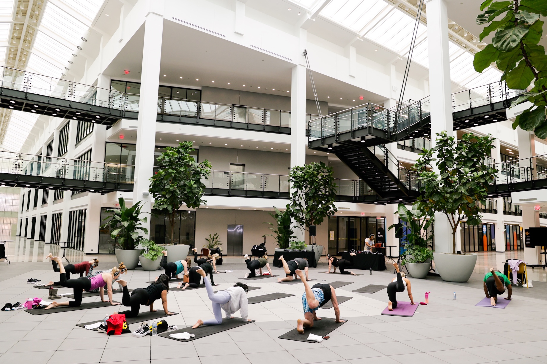 Yoga and other fitness classes in a common area are among the amenities on offer to office and industrial tenant employees.