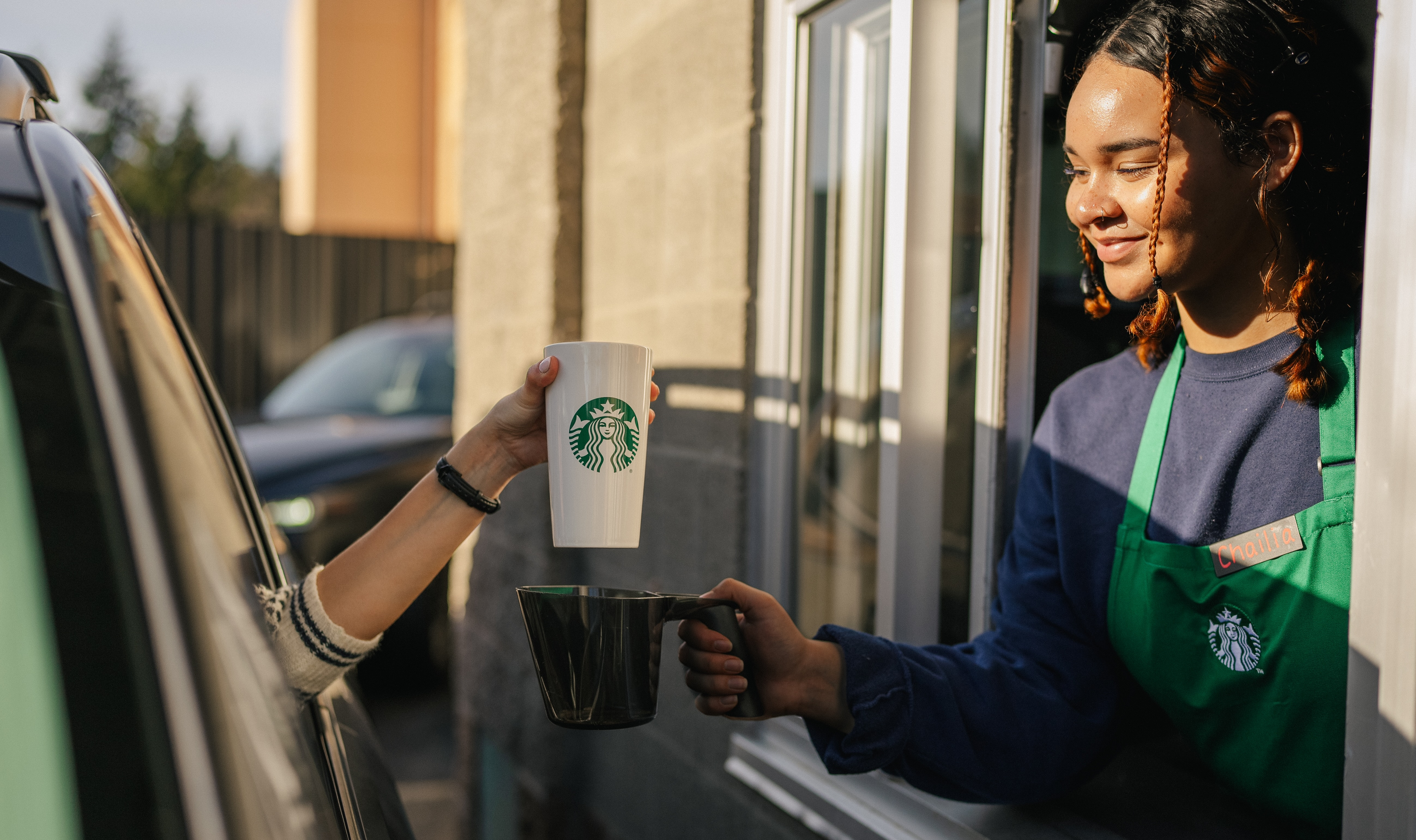 Locating in exurbs gives Starbucks room to build drive-thru coffee shops.
