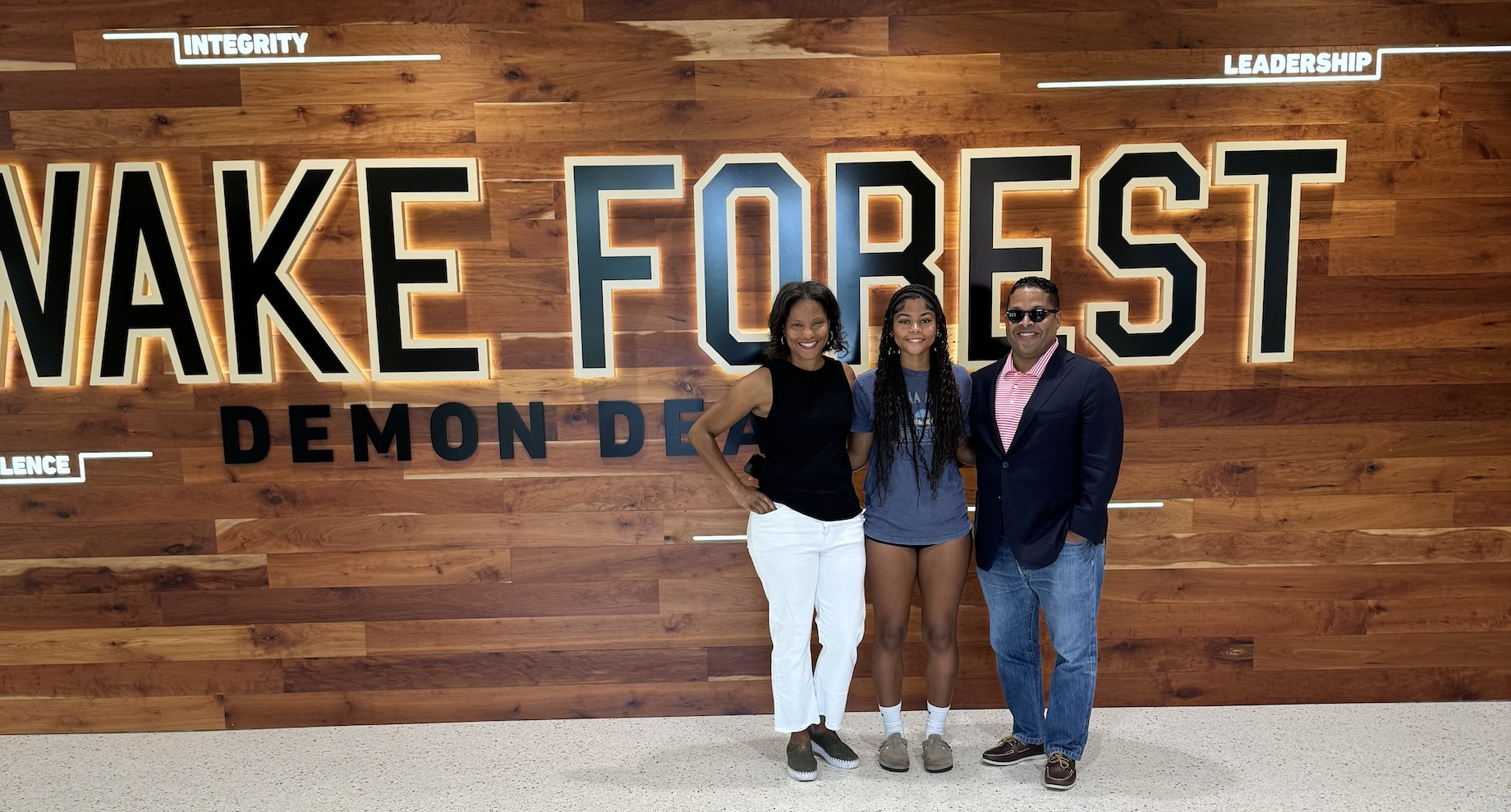Levi Strauss’ Carol Joyner Spann — at left, with her daughter and husband — last year received the inaugural Wake Forest Univ