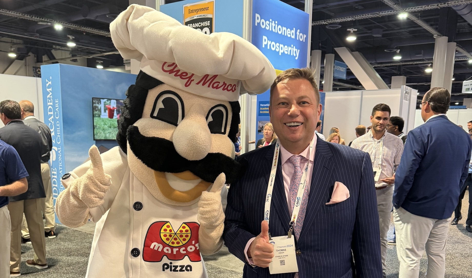 It’s decidedly not the Caped Crusader, but Stark & Stark’s Tom Onder still grabbed a picture with the Marco’s Pizza masco