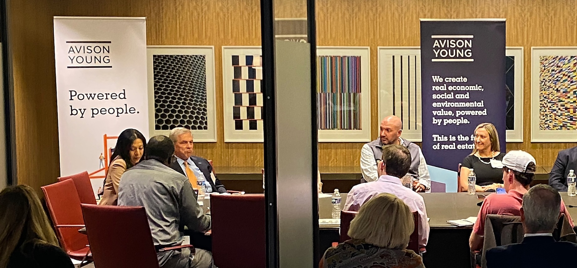 Avison Young’s Meghann Martindale, at far right, and her colleagues Harry Klaff, at left in a tie, and Jeff Lindenmeyer, cent