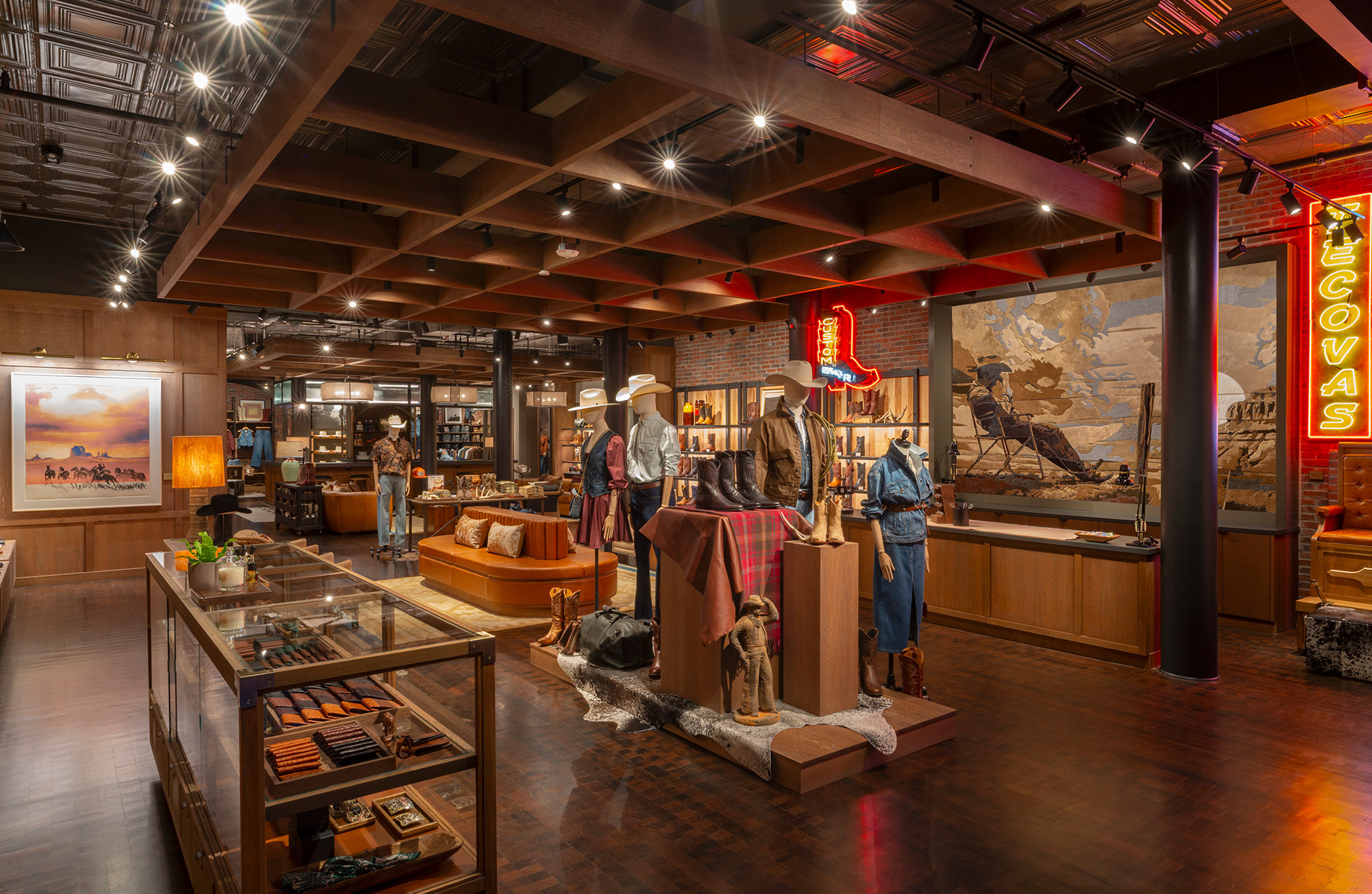 The store unfolds as a series of open zones designed to draw visitors into the space and foster a sense of discovery.