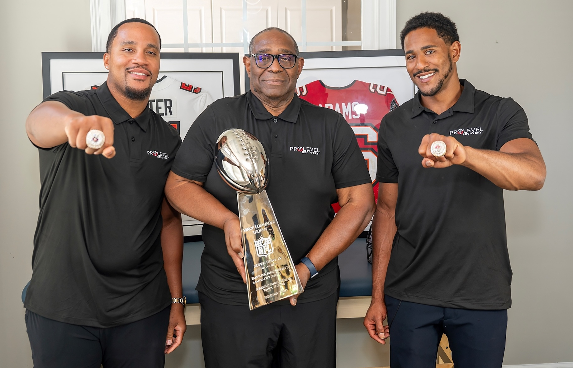 Andrew Adams (right), founder of ProLevel Recovery and a former NFL player, rebranded his father Aaron Adams’ (center) physic