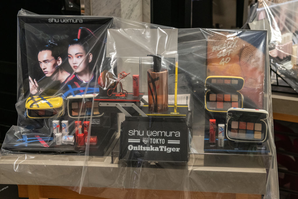 A plastic sheet prevents customers from handling makeup items