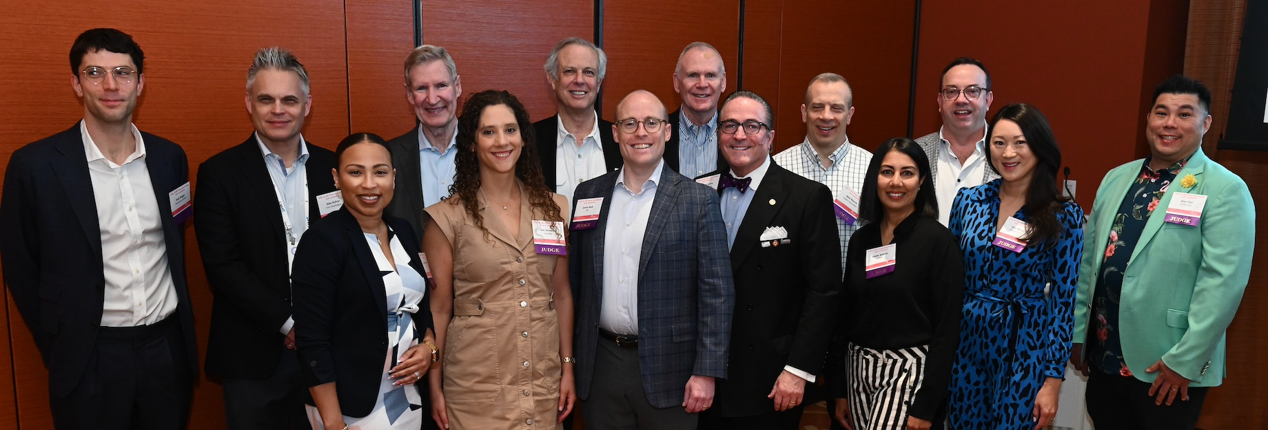 Preliminary round judges in the back row from left to right were Steerpoint Capital director of investments and development J