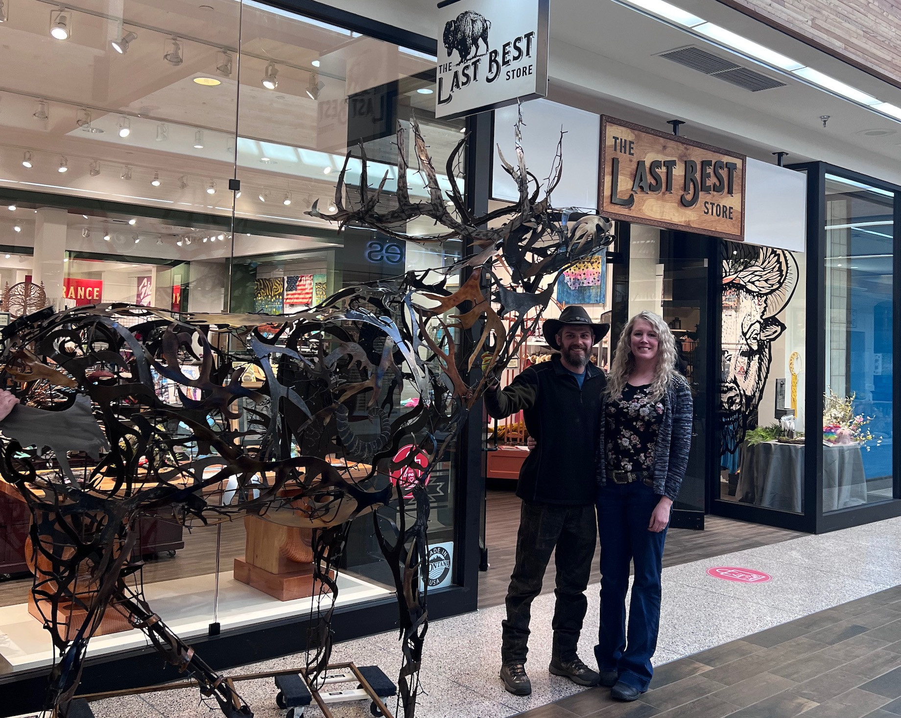 Metal sculpture artist Laura Jean Newby — based on Conner, Montana — and her husband move one of her welded creations into Th