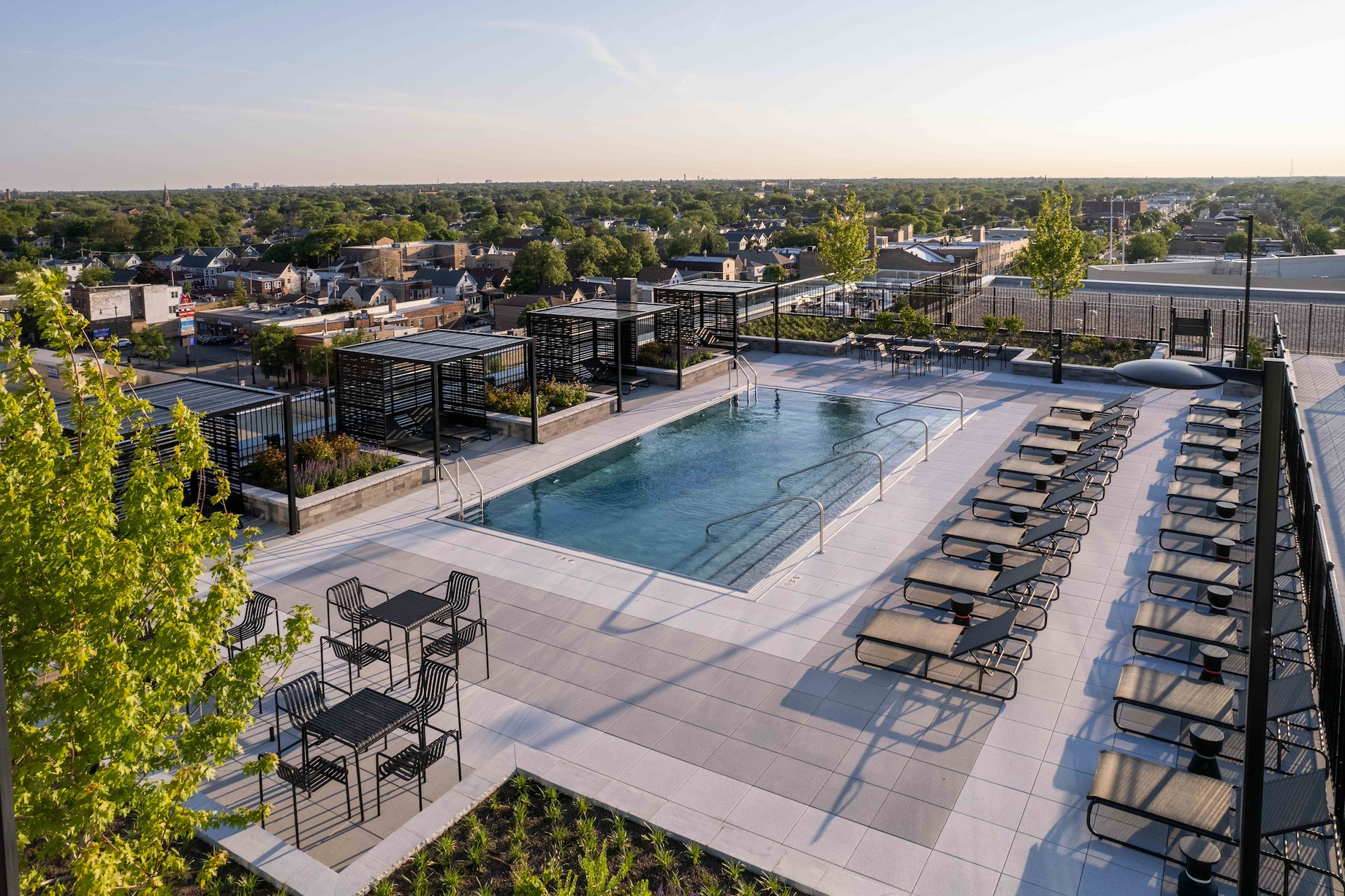 The building’s new top floor boasts a pool and deck, fitness room, dog park, speakeasy, community room and co-working space.