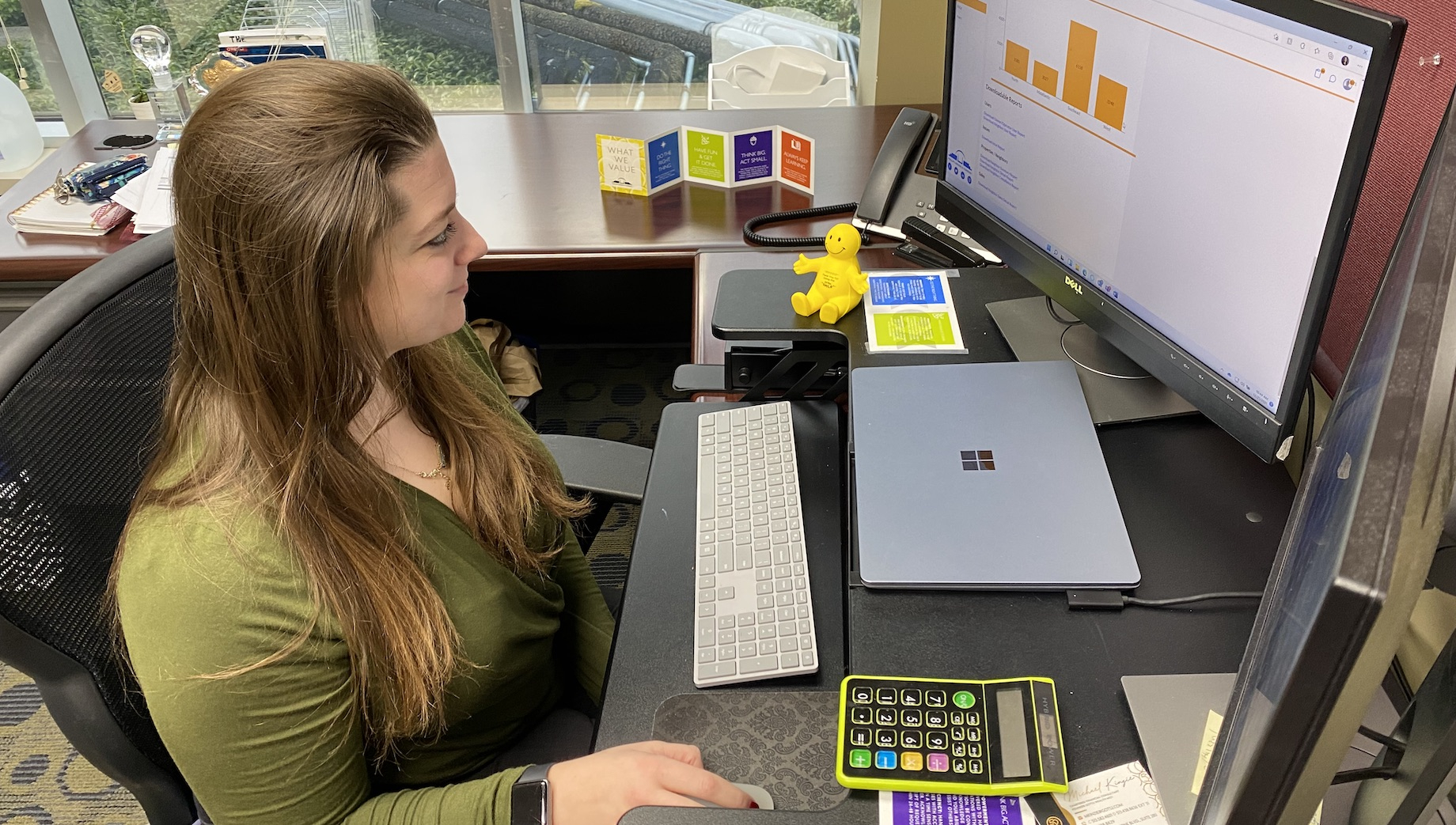 Phillips Edison & Co. director of customer experience Katelyn Wloszek eyeballs data in CenTeComm.