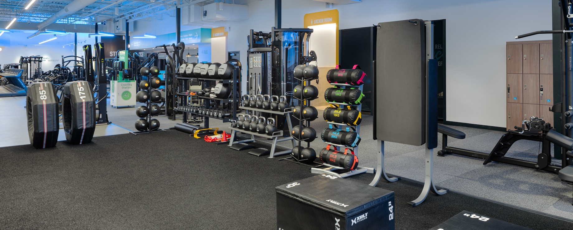 A turf area provides members with a variety of equipment, from tires to kettlebells.