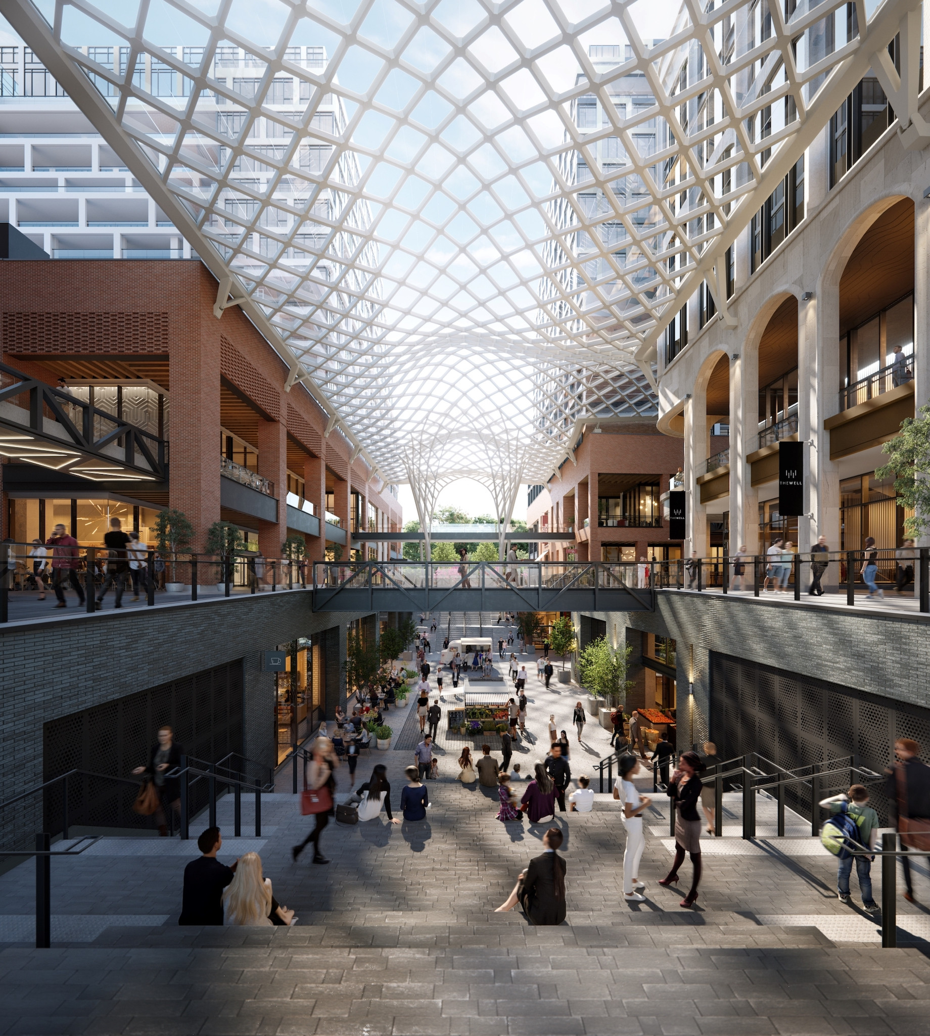 Along the spine of The Well’s three-story retail promenade is a 35,000-square-foot canopy of glass, fabricated in Germany, th