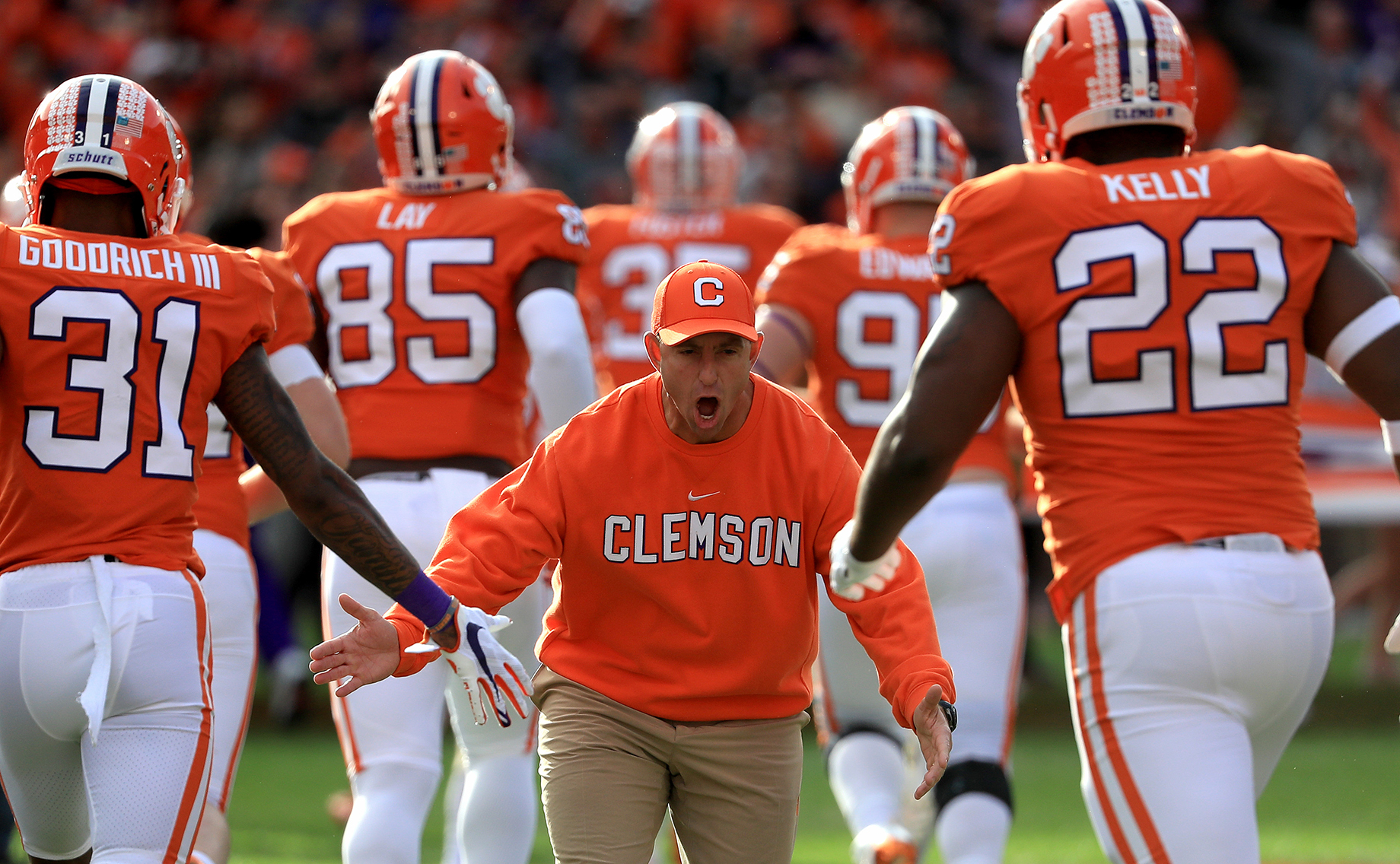 Head coach Dabo Swinney of the Clemson Tigers reacts with players before their game against the Wake Forest Demon Deacons at 