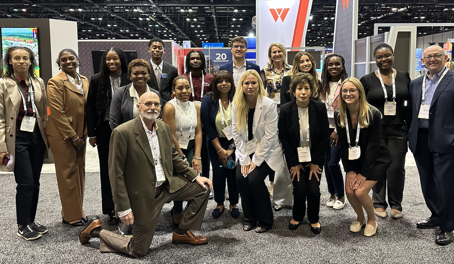 Florida Retail Scholarships founder Geoffrey Stevens, in front, with scholarship recipients and Woolbright Development employ